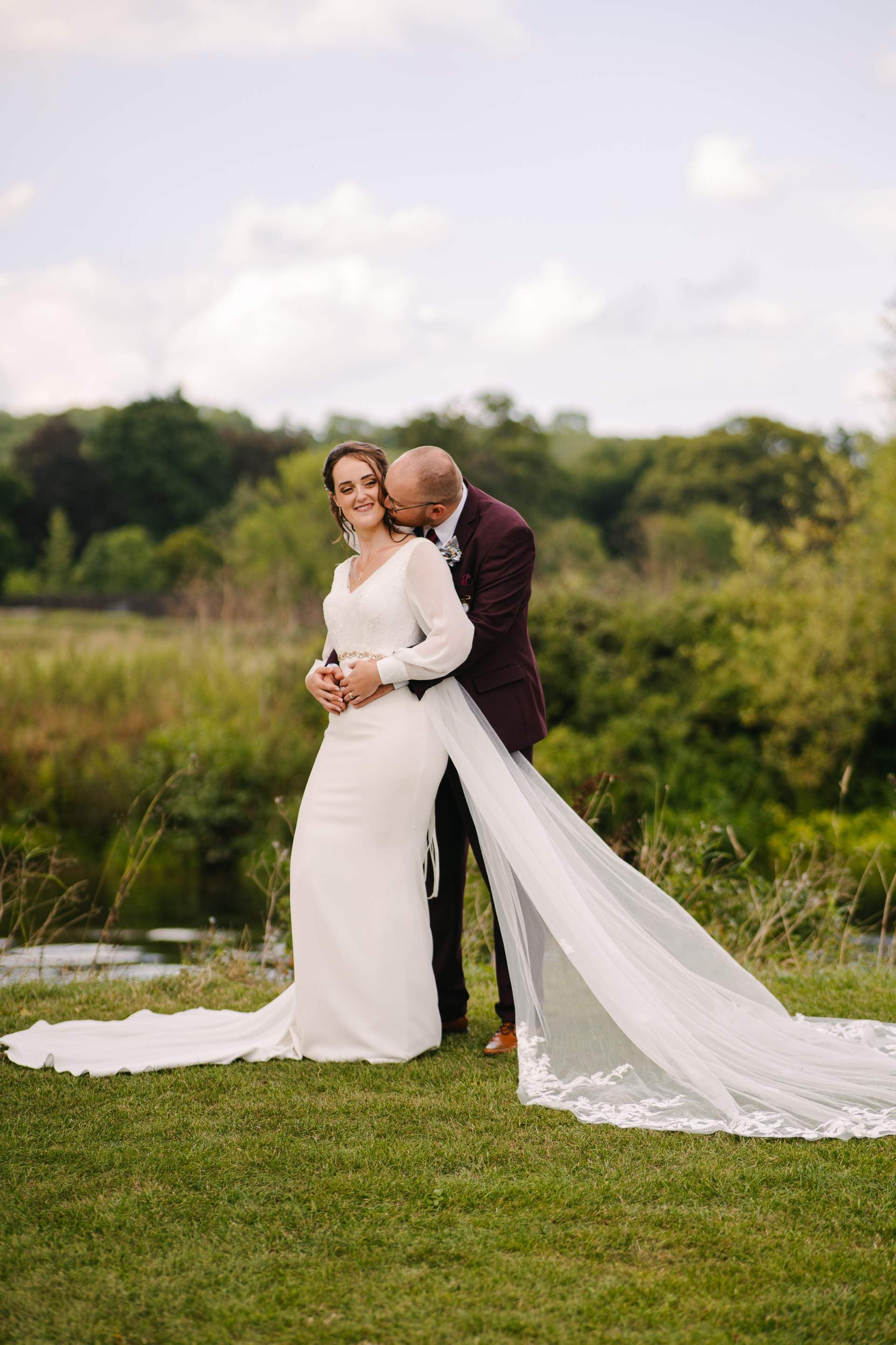bride and groom portraits in Stratford Upon Avon at riverside venue 