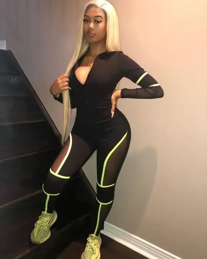 One piece body suit all black with neon green trimming