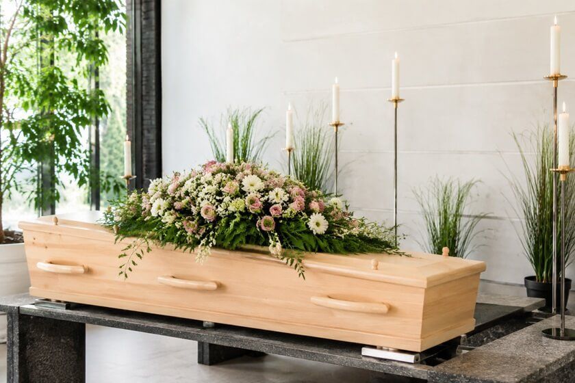 a wooden casket for direct cremation services in West Allis, WI