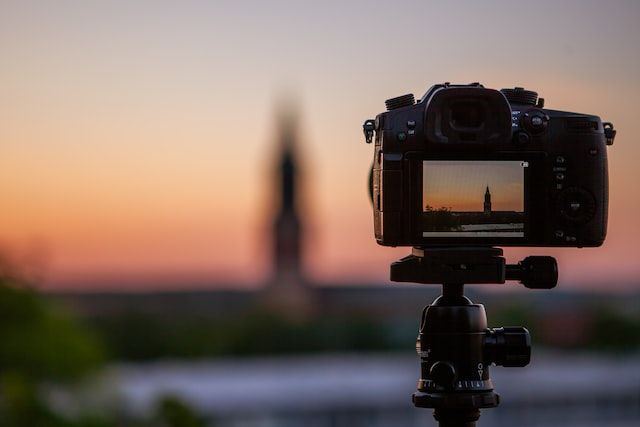 Camera capturing a sunset scene in Wauwatosa, WI, funeral homes use photography and video tributes like this to create meaningful memorial presentations that celebrate a loved one’s life.