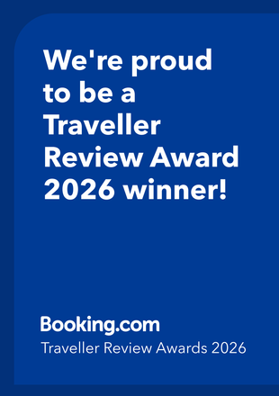 Booking.com blue award badge: “We’re proud to be a Traveller Review Award 2026 winner!”