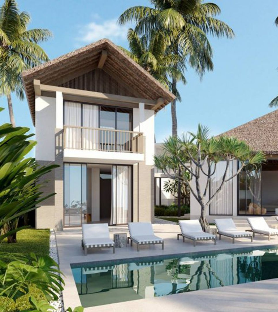 Luxury tropical villa with pool, white loungers, and palm trees under a blue sky