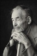A black and white photo of an older man with a cane
