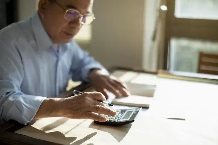 man with calculator