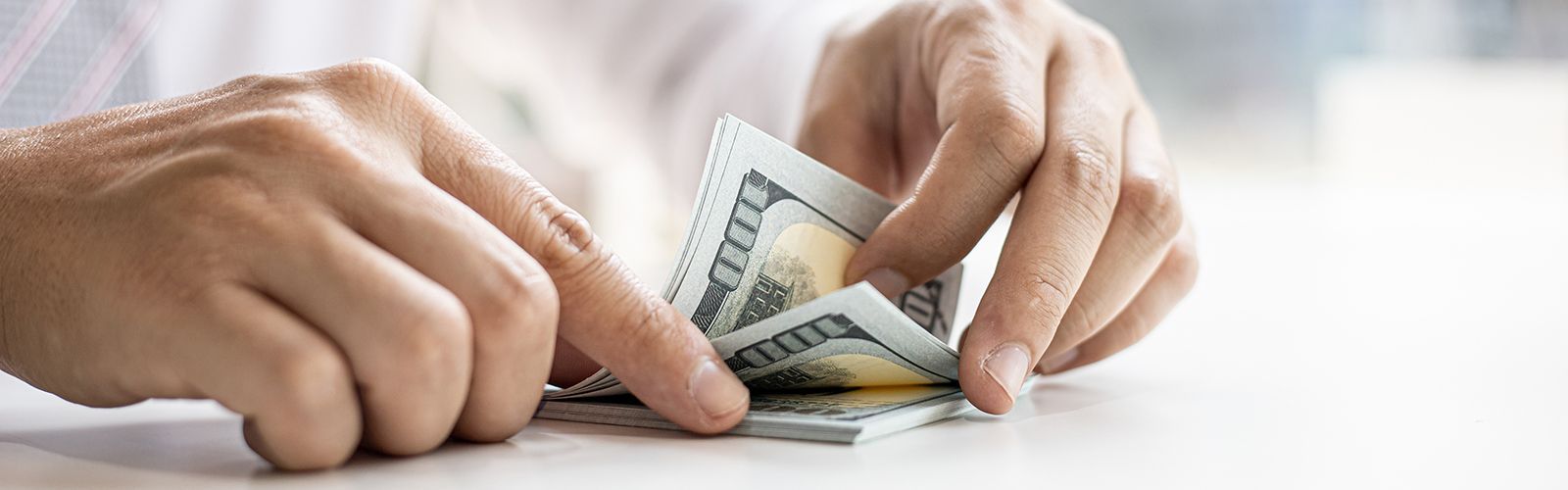 man counting money