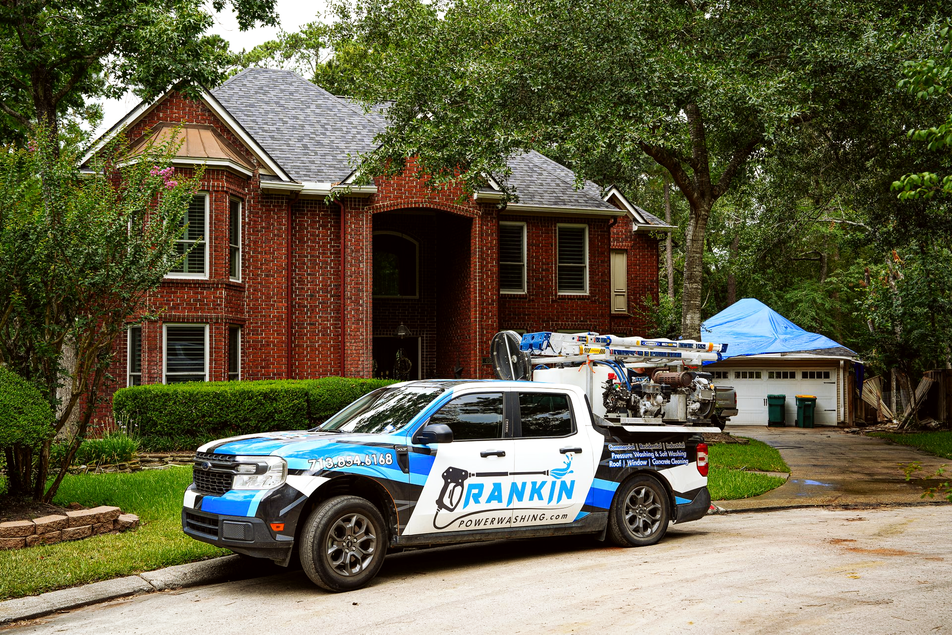 Pressure washer removing grime from residential walkway in Houston