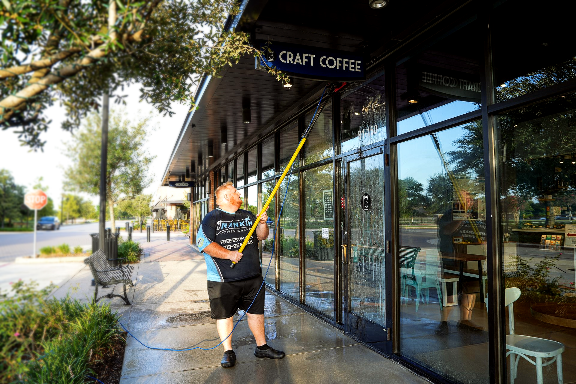 Storefront sidewalk being pressure washed for improved curb appeal