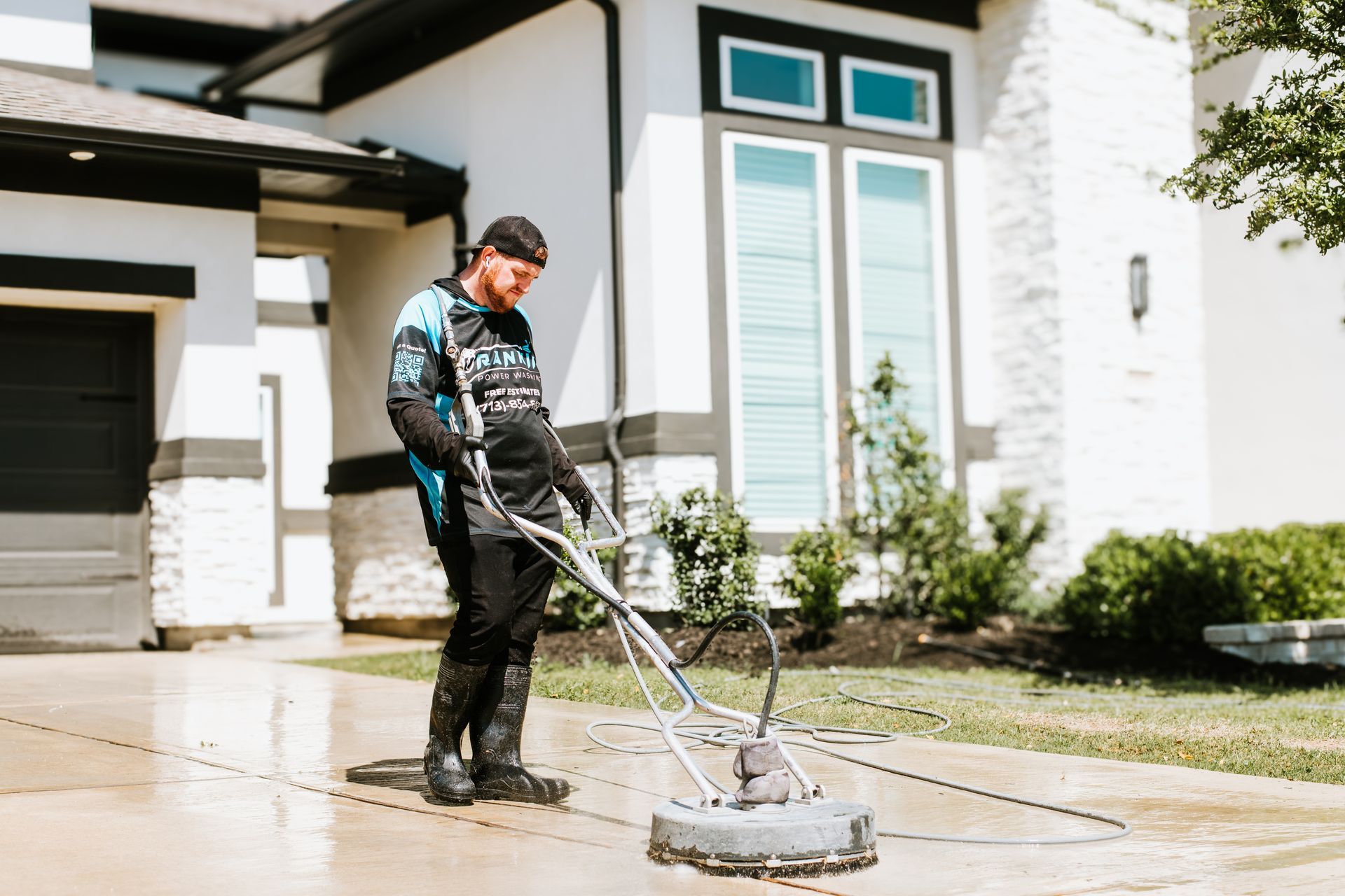 Close-up of water spray cleaning dirty sidewalk in Houston neighborhood