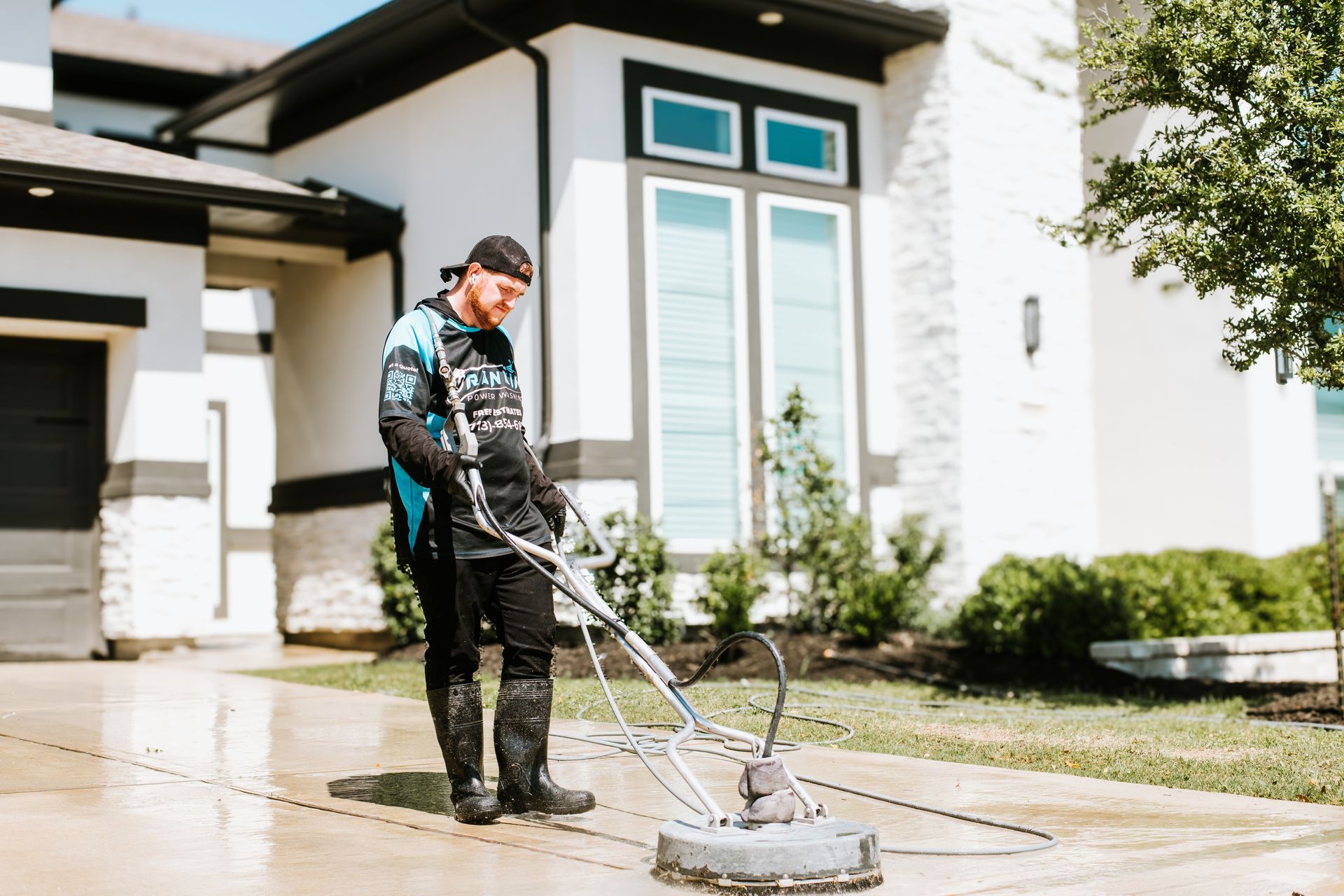 Pressure washer removing grime from residential walkway