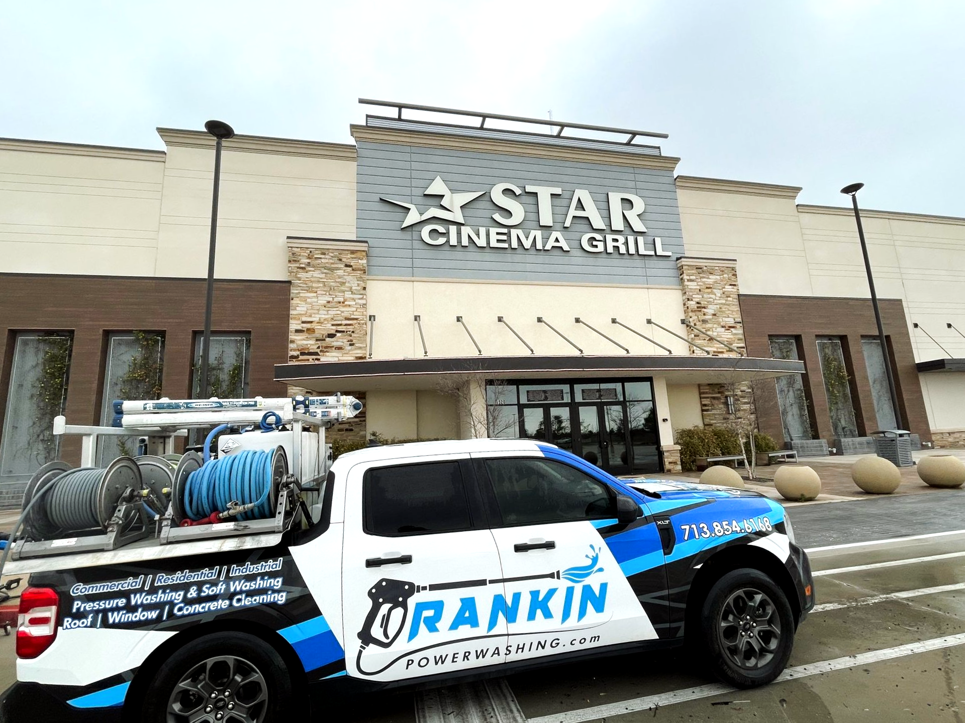 Storefront sidewalk being pressure washed for improved curb appeal in Houston