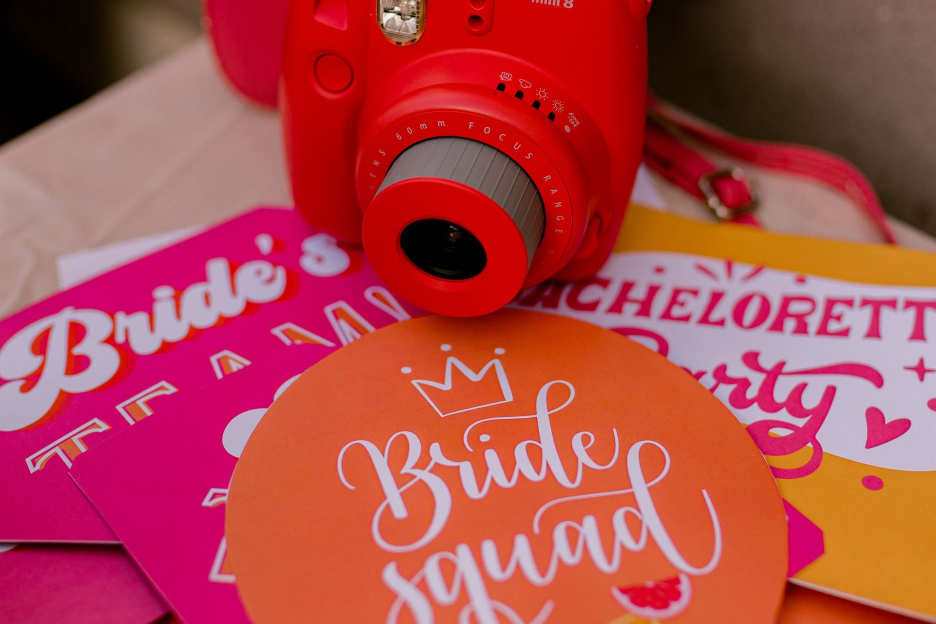 Wedding photo booth props in a basket, including glasses, signs, and a “Just Married” frame.
