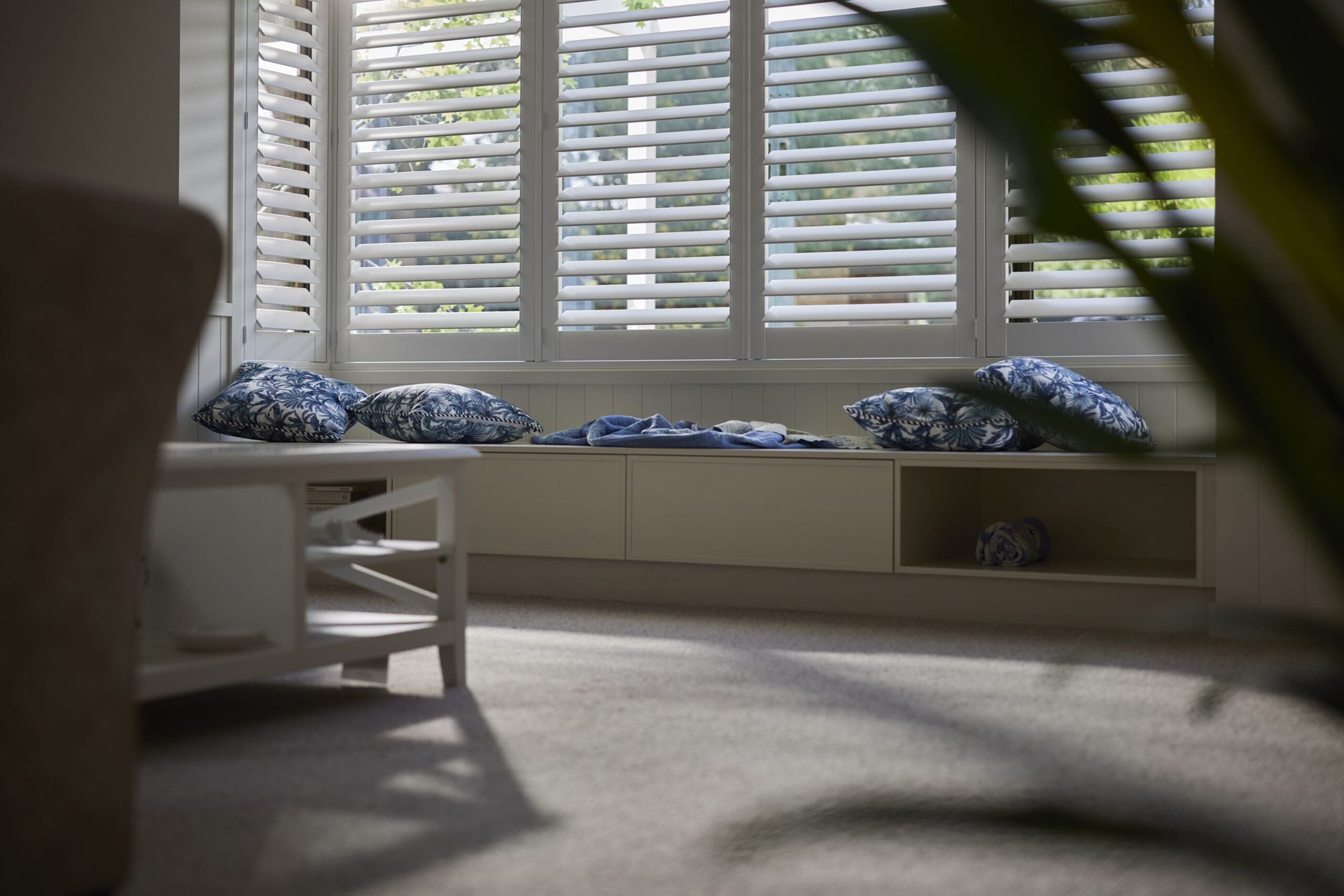 Living Room With White Shutters, a Coffee Table — LeSands Screens & Blinds Moss Vale Pty Ltd in Moss Vale, NSW