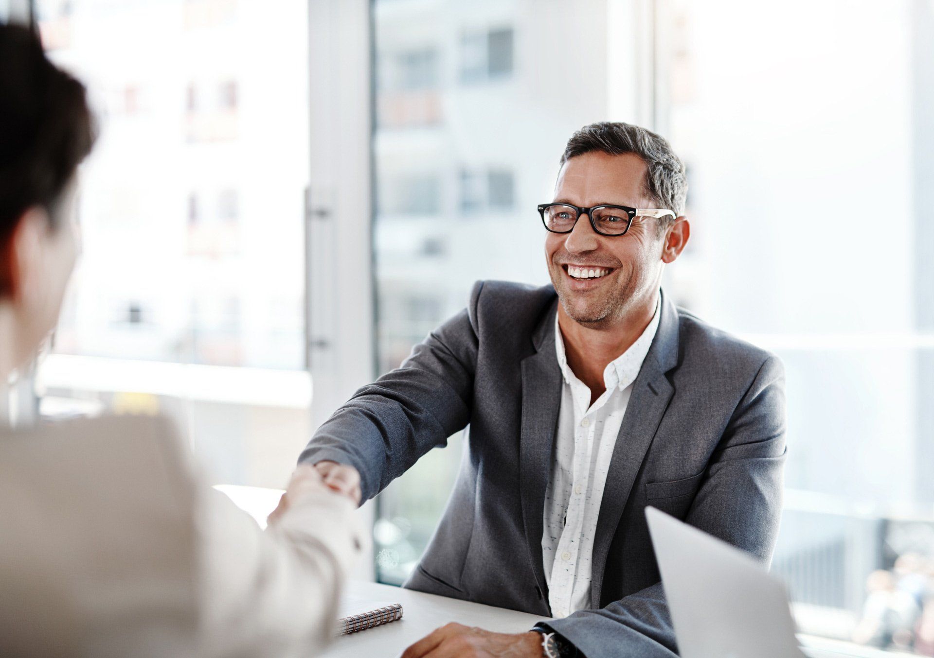 Shot of Two Businesspeople Shaking Hands in an Office | Bacchus Marsh, Vic | Haines Conveyancing Shot of Two Businesspeople Shaking Hands in an Office | Bacchus Marsh, Vic | Haines Conveyancing