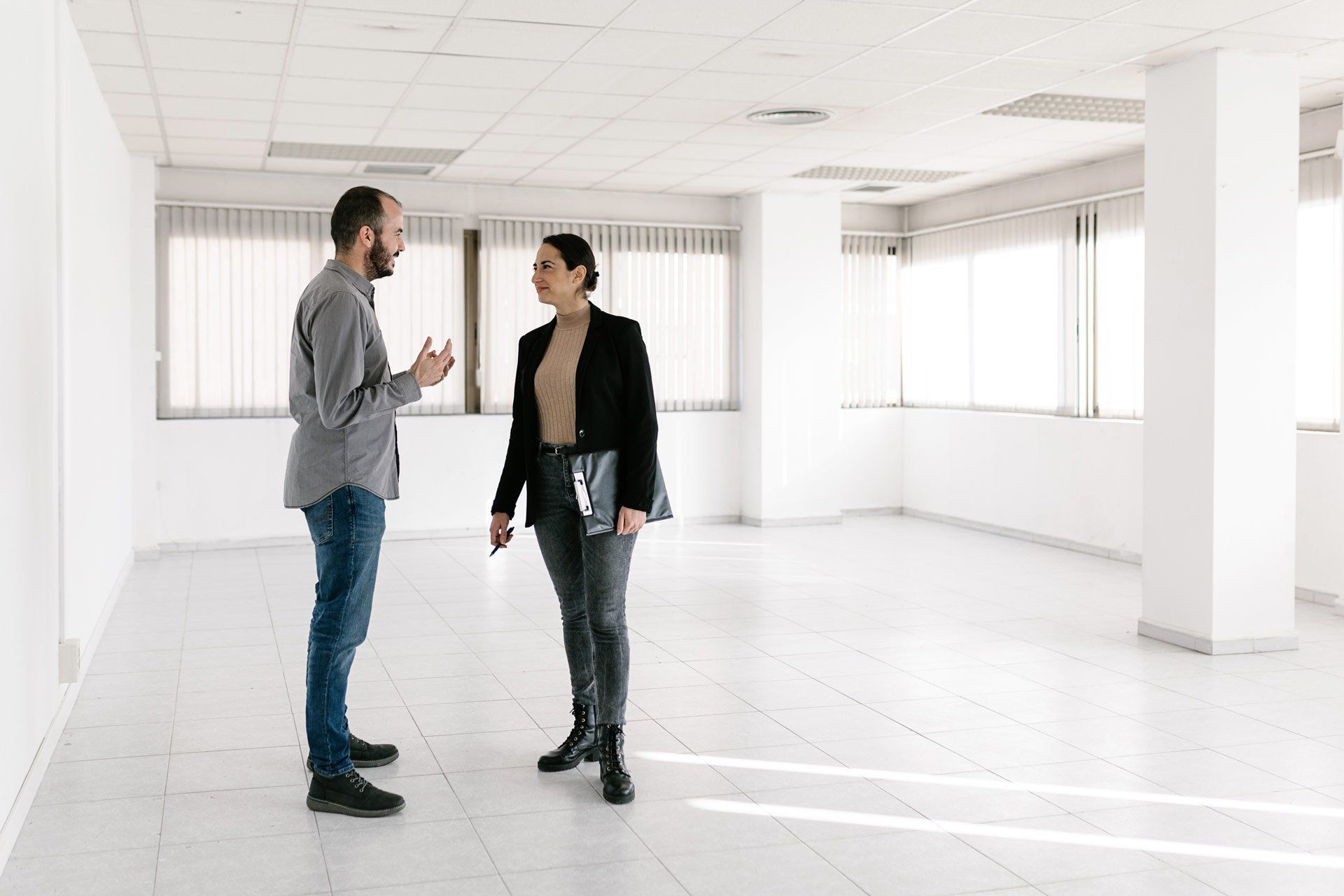 Young Adult Man Discussing with a Real Estate Female Agent | Bacchus Marsh, Vic | Haines Conveyancing Young Adult Man Discussing with a Real Estate Female Agent | Bacchus Marsh, Vic | Haines Conveyancing