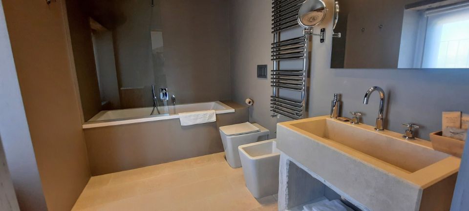 b&b room with bathtub with shower