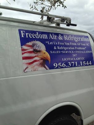 Freedom Air & Refrigeration service van with company sign and phone number on the side.