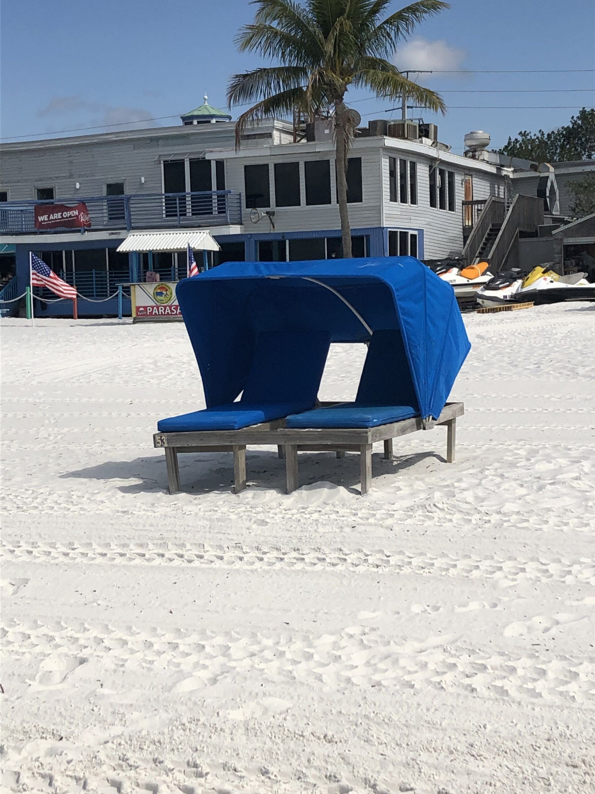 Blue cabana on beach shore