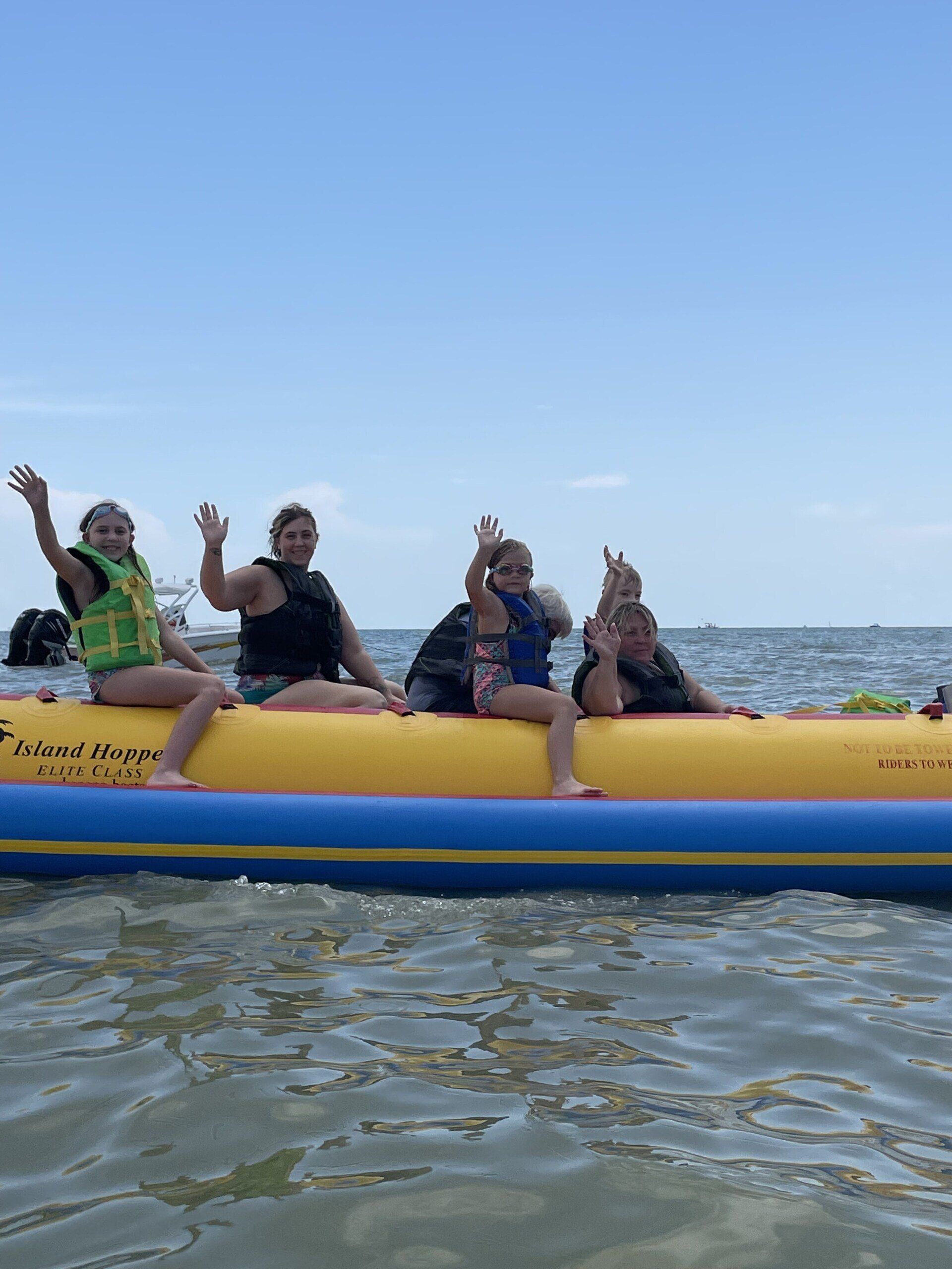 Close view of a people riding on a banana boat