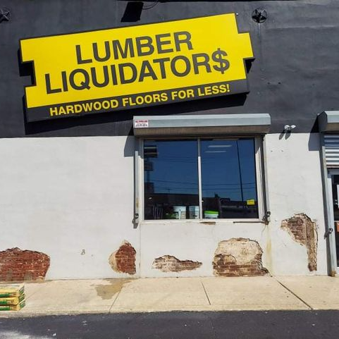 A building with a sign that says lumber liquidators