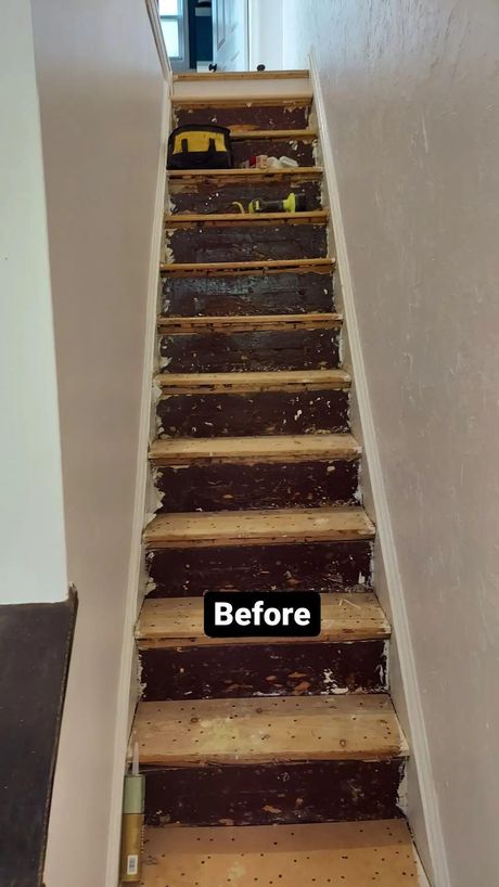 A picture of a staircase before being painted.