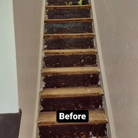 A picture of a staircase before being painted.