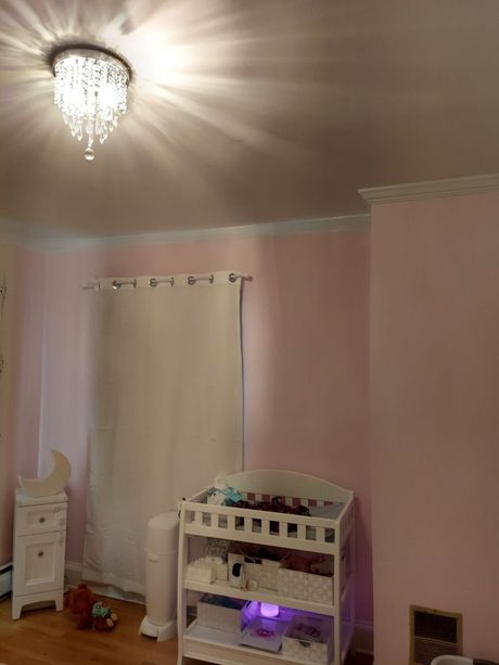 There is a changing table in the middle of the room.
