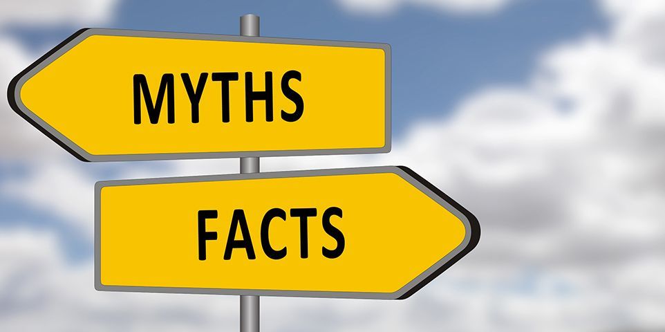 A yellow sign that says myths and facts on it