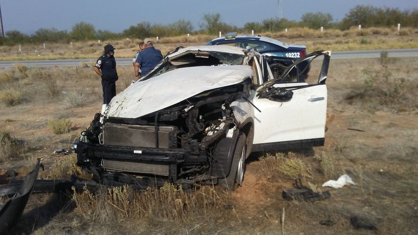 A white car that has been damaged in a car accident