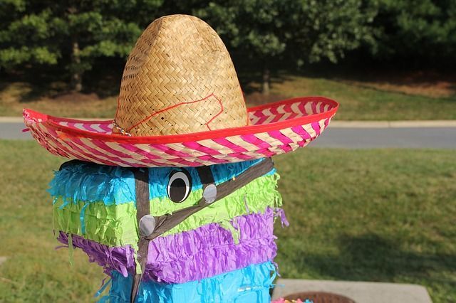 Sanborn's Mexico Insurance Cinco de Mayo A colorful piñata with a sombrero on top of it.