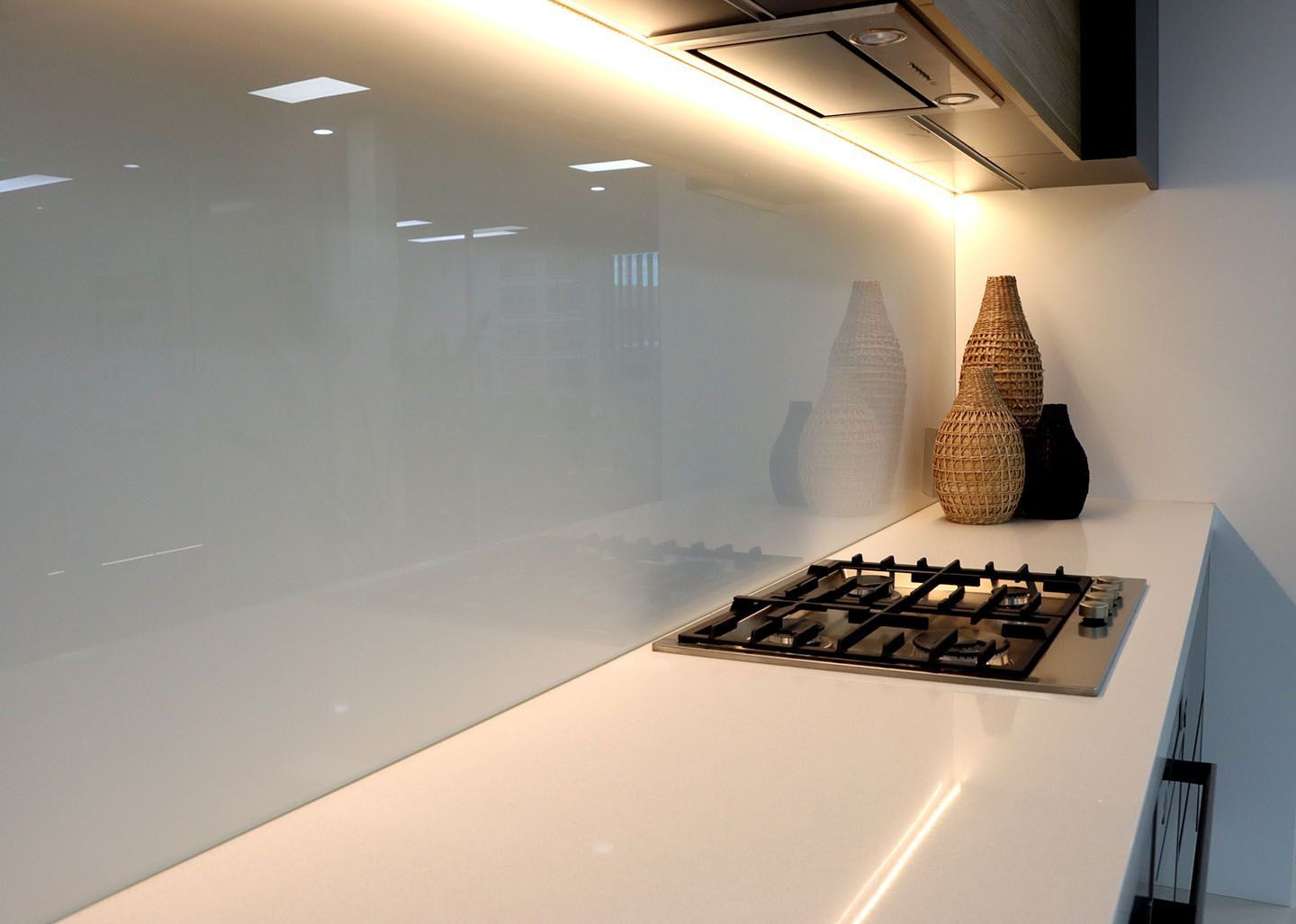 A Kitchen with A Stove Top Oven and A White Counter Top — DecoGlaze in Cardiff, NSW