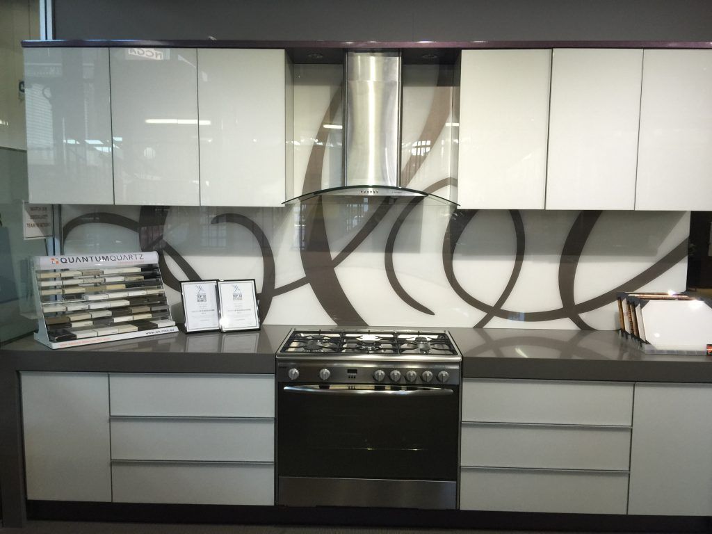 A Kitchen with Stainless Steel Appliances and White Cabinets — DecoGlaze in Cardiff, NSW