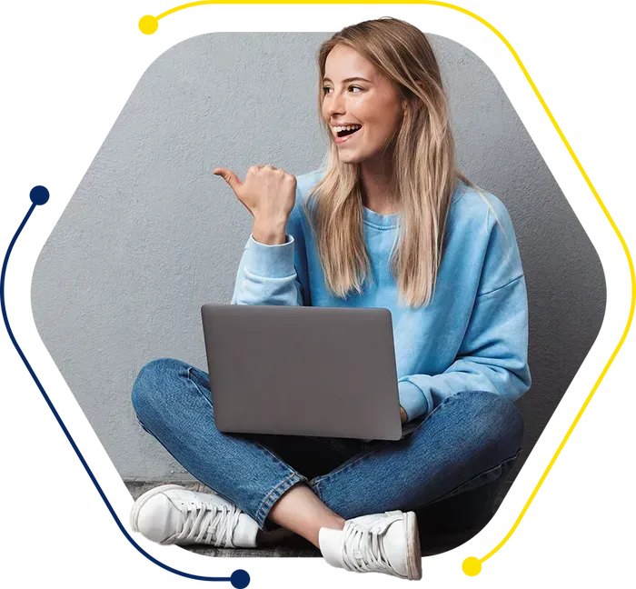 a woman is sitting on the floor with her legs crossed and using a laptop