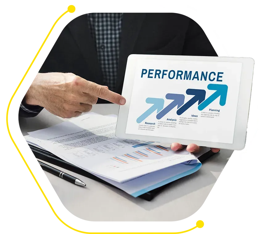 a person is pointing at a tablet that says performance