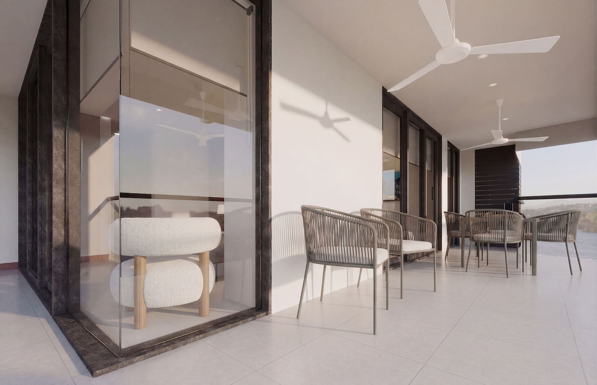 Hotel Bello Horizonte Santa Marta con terraza de suite, comedor exterior, sillas, ventanales y luz natural en Nuruma Suites
