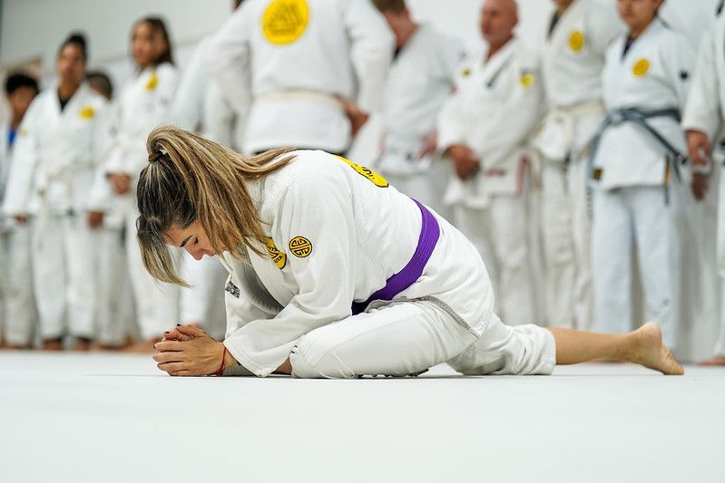 Coach Azul Hartman stretching before class.
