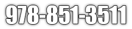 White outlined phone number 978-851-3511 on a light background