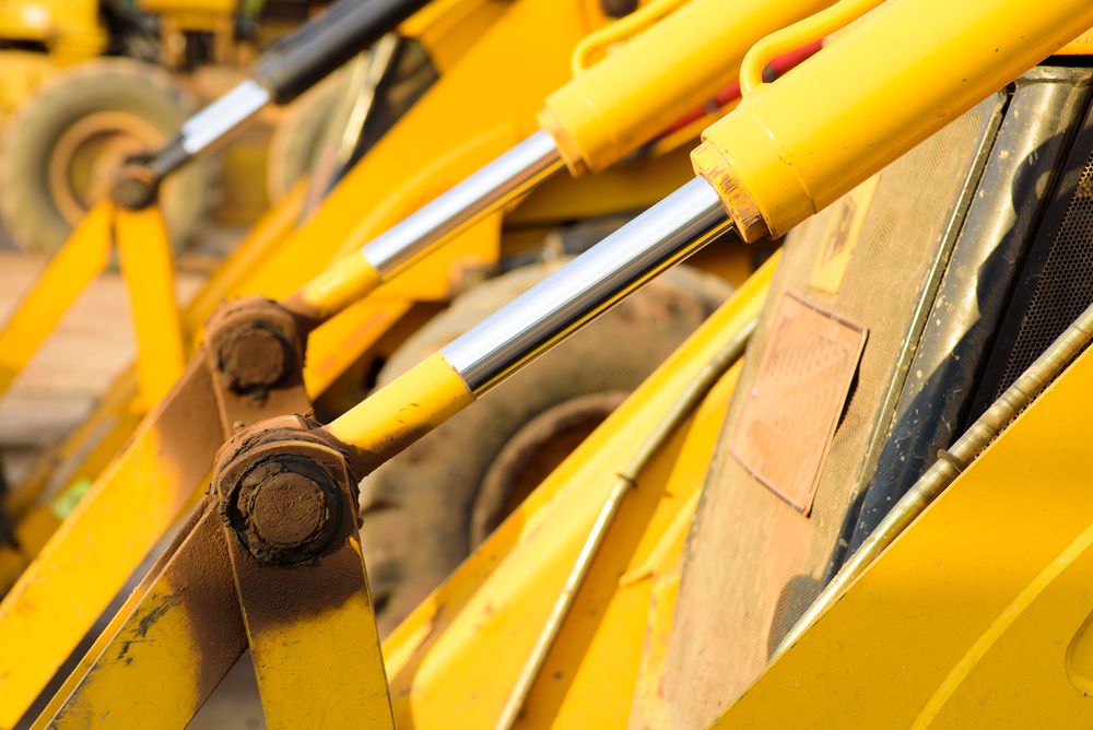 Yellow Heavy Machinery with Hydraulic Cylinders — Berkeley Vale Hydraulics in Fountaindale, NSW