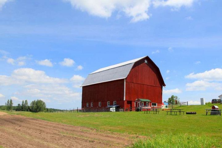 traditional finnish red wooden barn roundpole