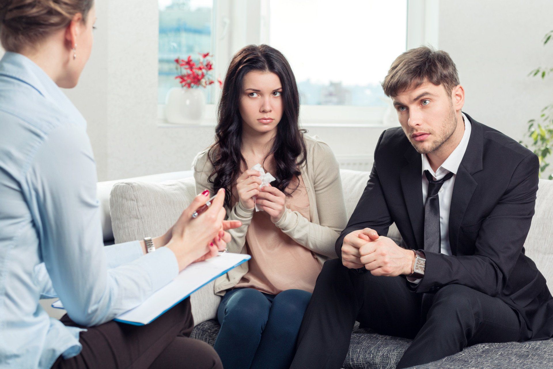 Young couple speaking to a lawyer