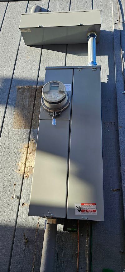 A meter is sitting on top of a wooden deck.