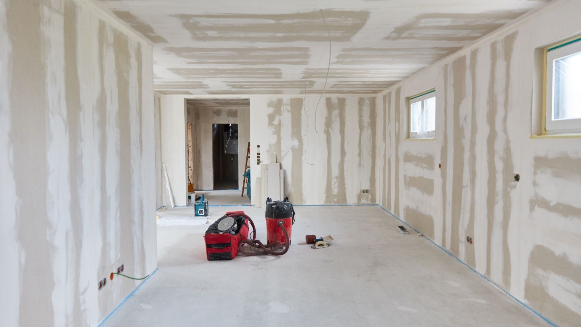 High-speed air movers drying flooded property interior