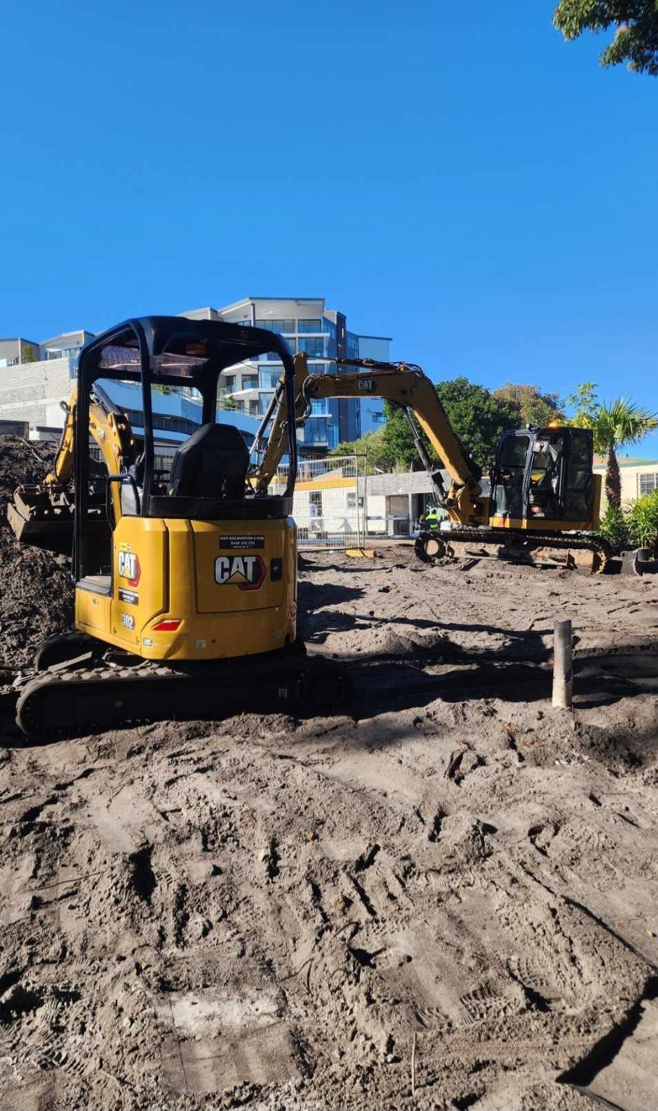 Factory Building Demolition with yellow digger — CHT Excavation and Hire In Wherrol Flat NSW