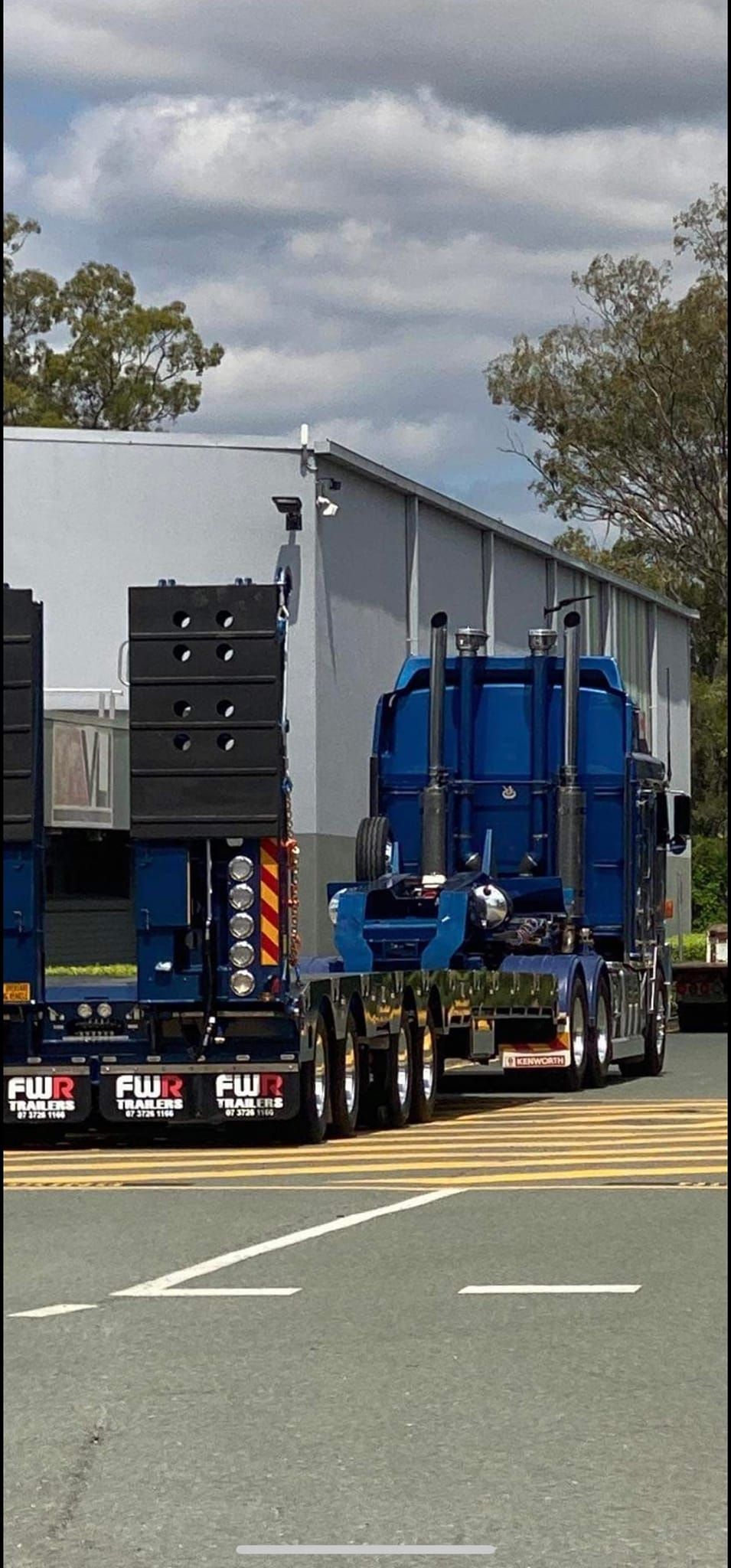 Heavy New Yellow Excavator On-Transportation Truck With Long Trailer Platform — CHT Excavation and Hire In Wherrol Flat NSW