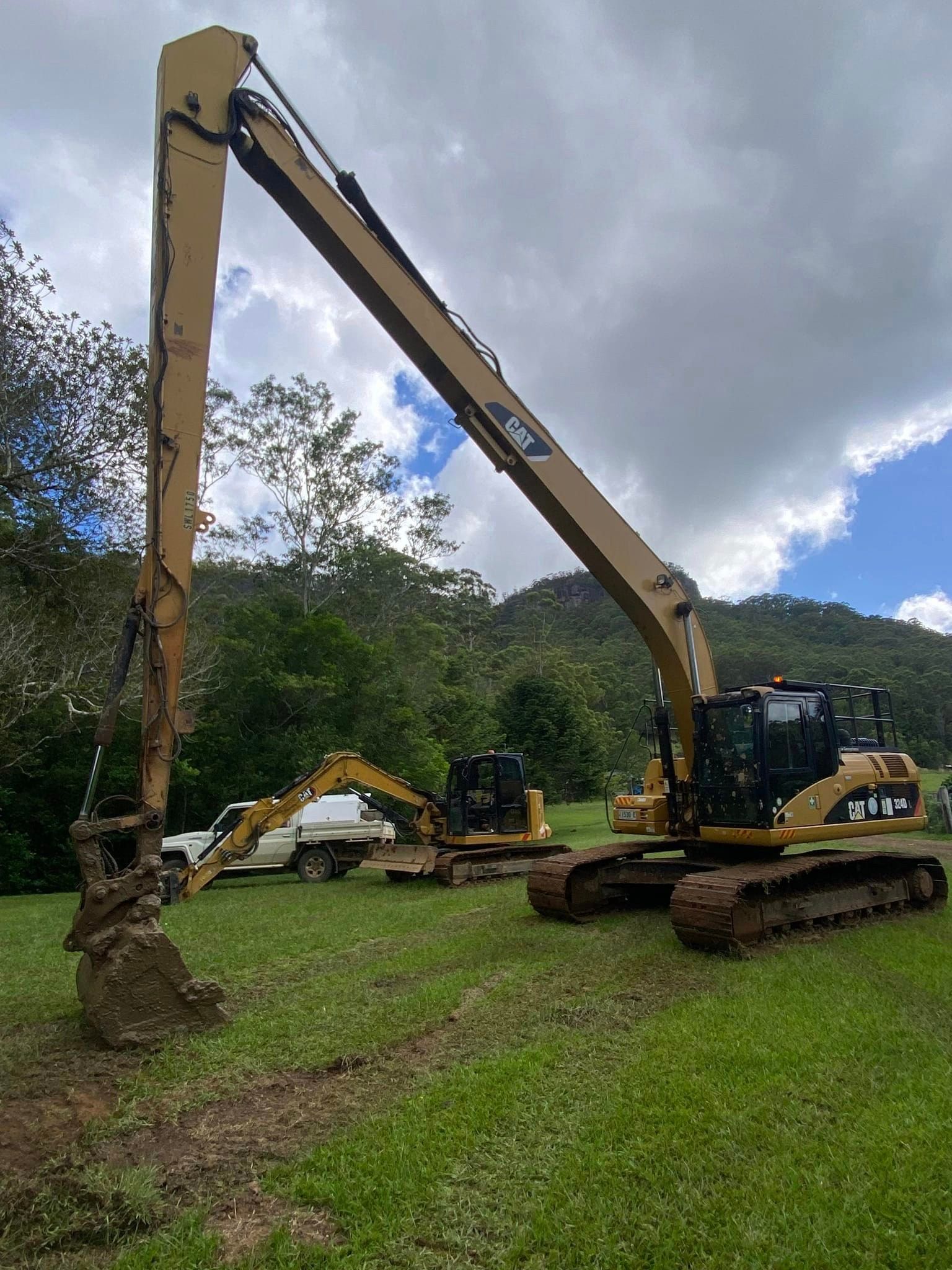 Excavator Loader Machine During Earthmoving Works Outdoors — CHT Excavation and Hire In Wherrol Flat NSW