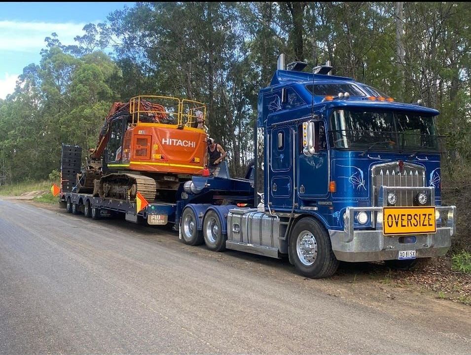Bulldozer On A Heavy Platform For Transportation — CHT Excavation and Hire In Wherrol Flat NSW