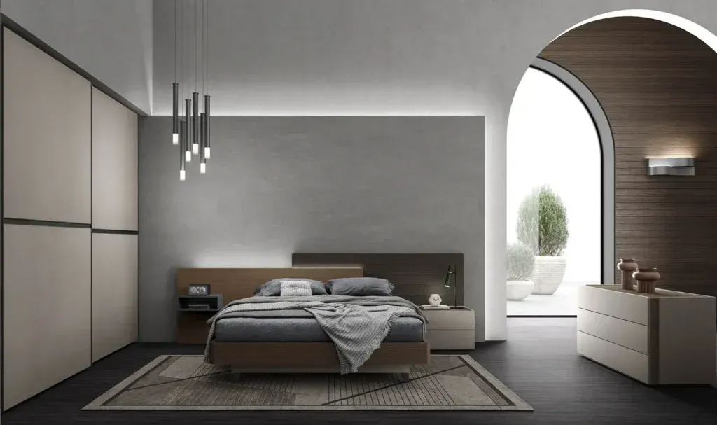 Una camera da letto con un letto grande e una cassettiera