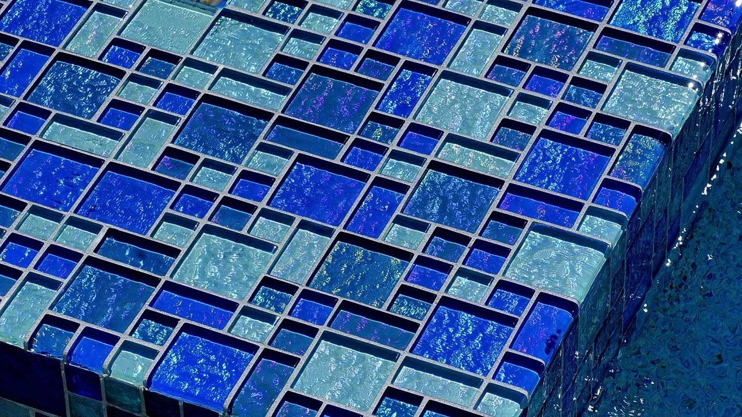 Blue and teal mosaic tile surface.
