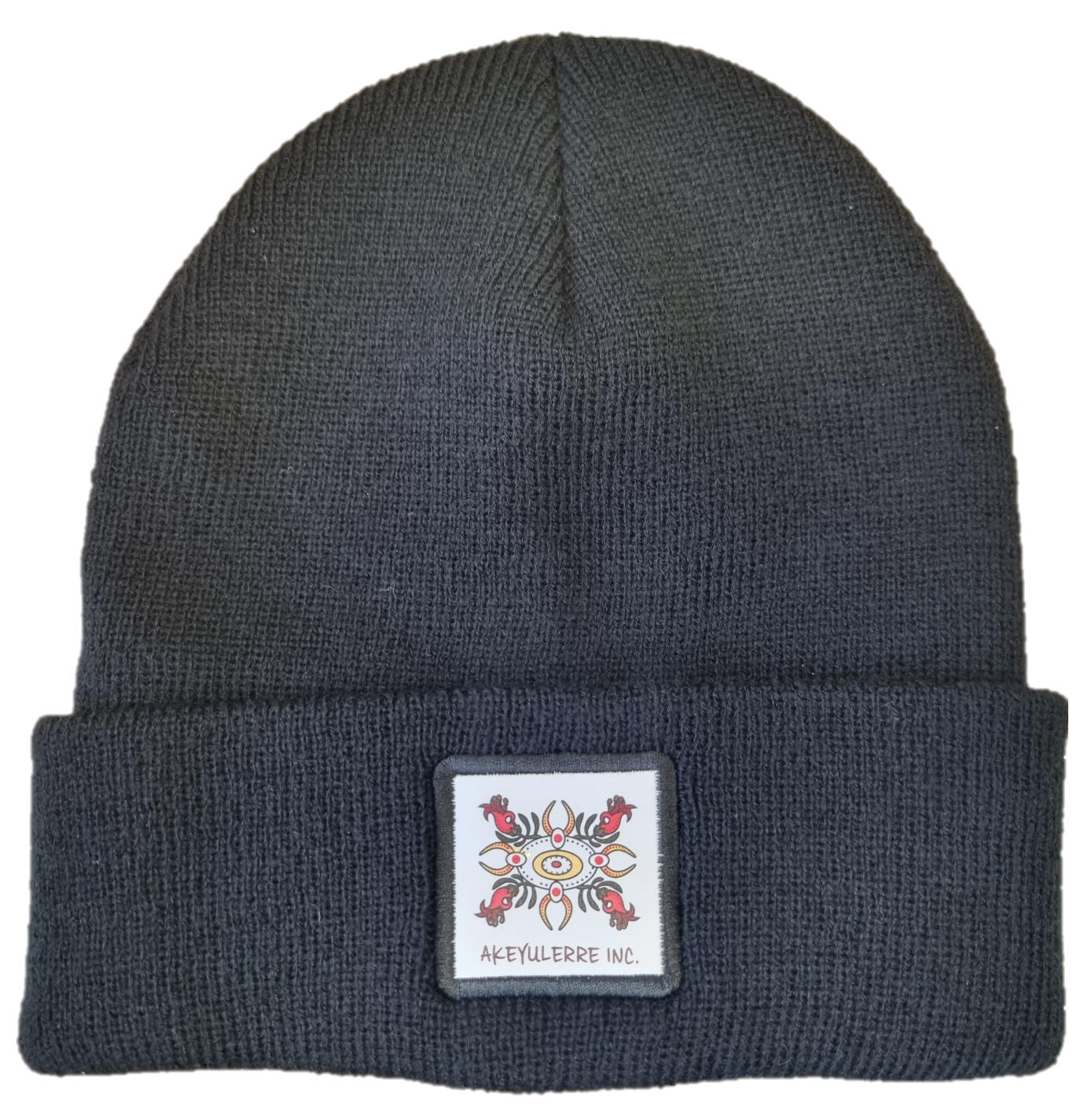 A black knit beanie with a folded cuff featuring a square patch displaying a red and gold symmetrical crest logo.