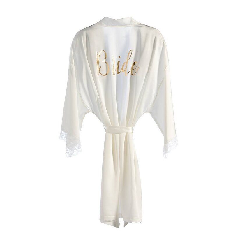 A white robe with the word bride embroidered on the back.