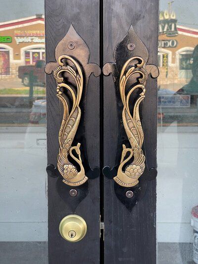 A close up of a door with a fancy handle